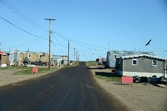 17A Driving Down The Street Past Buildings On Arctic Ocean Tuk Tour In Tuktoyaktuk Northwest Territories.jpg
